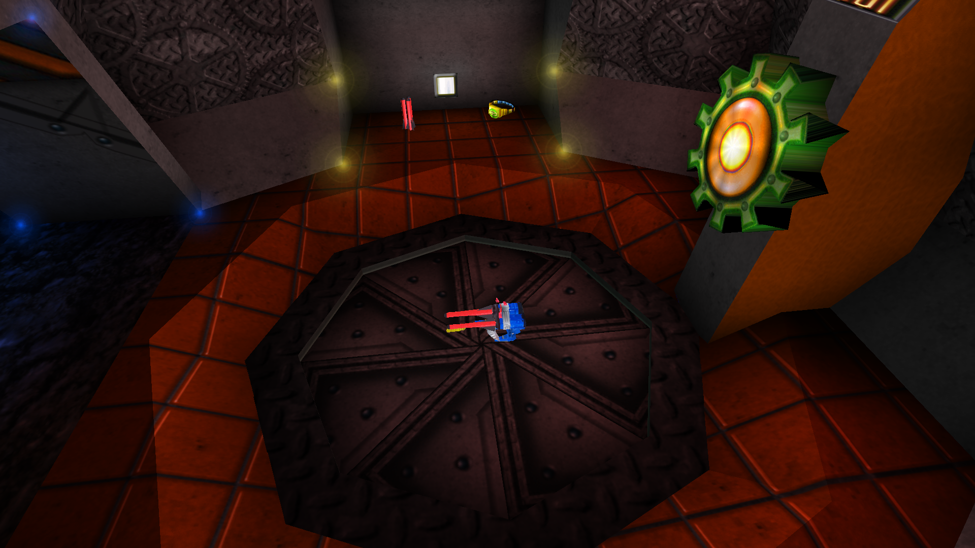A picture of a closed metal aperture with a Triplestrike on it, a gear-shaped trigger nearby.